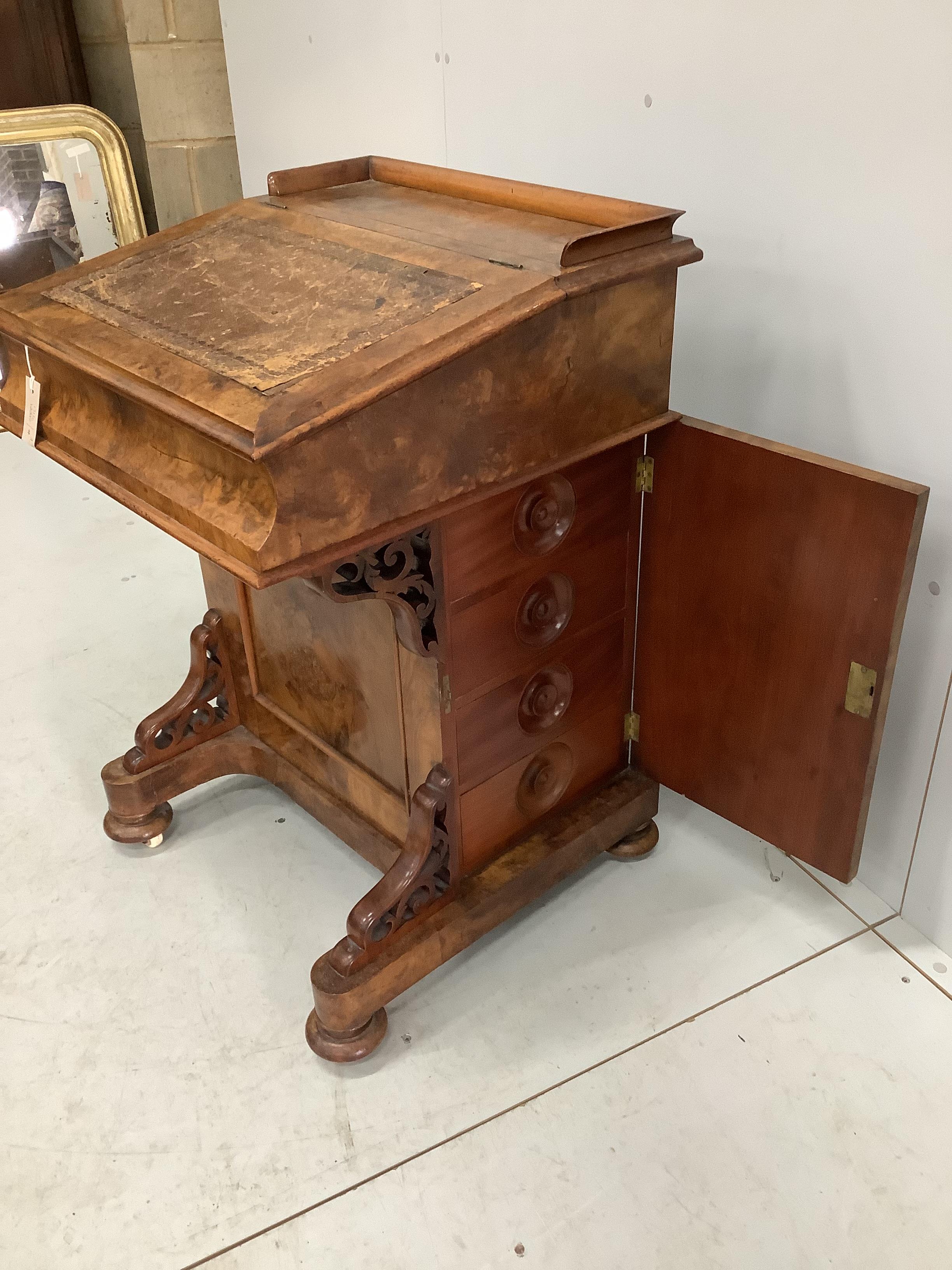 A Victorian walnut Davenport, width 57cm, depth 56cm, height 64cm